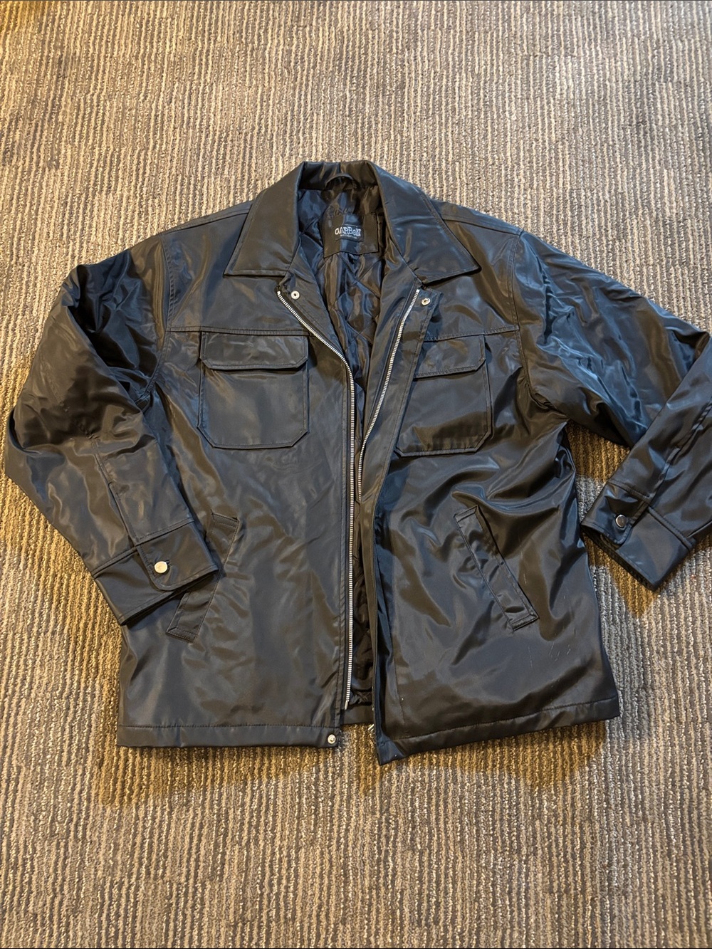 Black zippered jacket with quilted lining